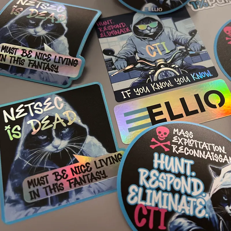 Collection of holographic cybersecurity-themed stickers featuring cats with text "NETSEC is DEAD", "MUST BE NICE LIVING IN THIS FANTASY", "IF YOU KNOW, YOU KNOW", "HUNT RESPOND ELIMINATE" and ELLIO branding